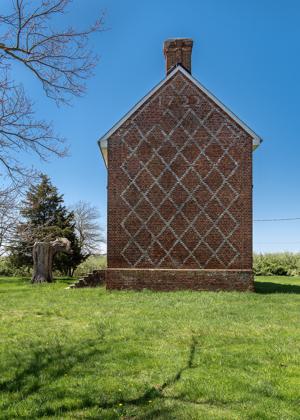 Diaper patterned brickwork on gable, dated 1722